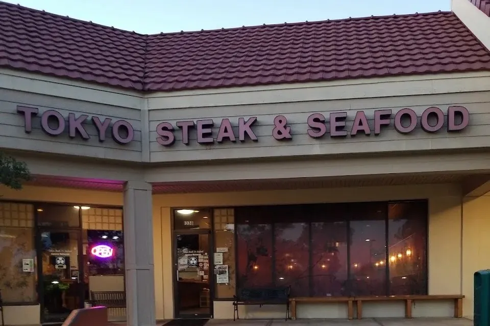 Tokyo Steak & Seafood storefront with a red tile roof and purple sign letters